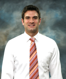 man wearing red tie smiling